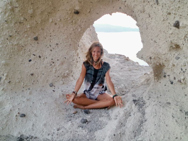 Sitting inside the heart of the rock in Santorini Greece